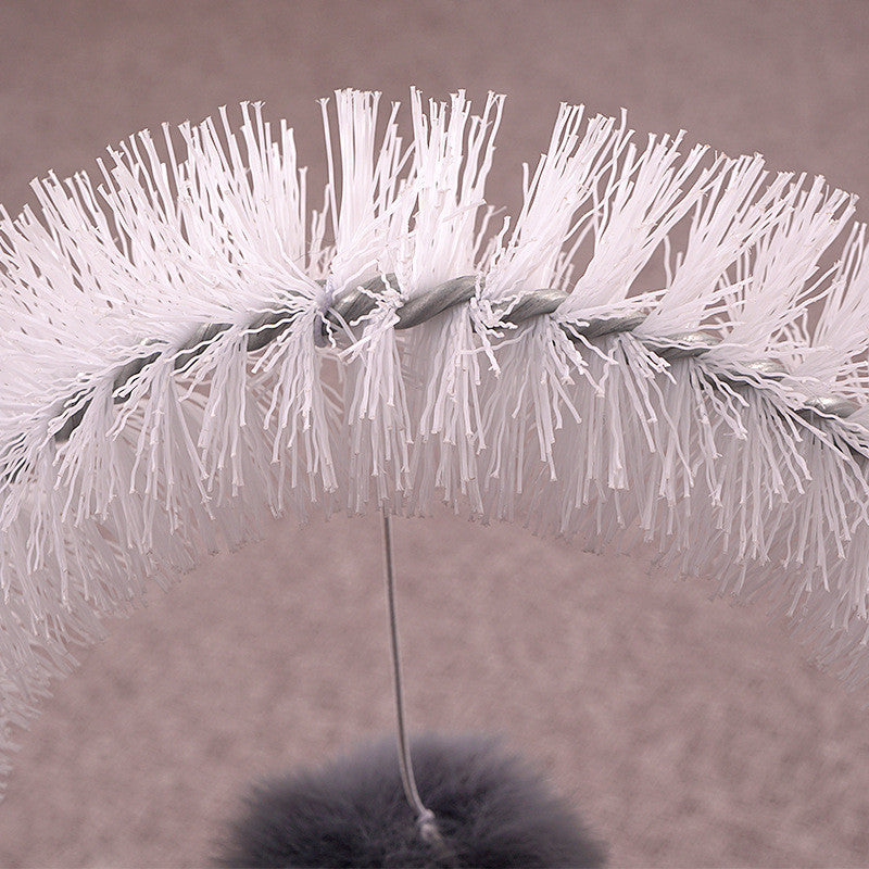 Cat scratching itchy brush Treyfe